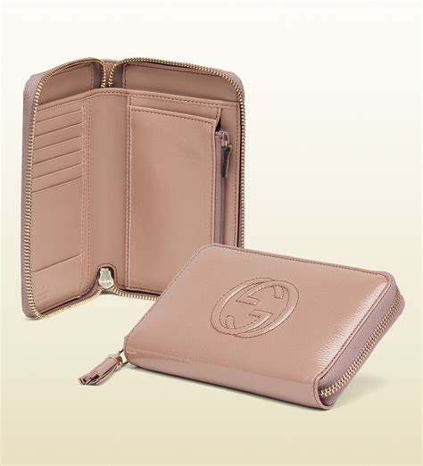 Zip around wallet with Gucci script in pink leather